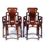 Pair of huanghuali throne chairs Chinese each with a carved back and solid seat 95cm high