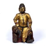 Carved wood and gilt guardian figure Chinese, 17th Century the figure having a long necklace and