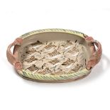 Willie Carter (British 20th Century) Stoneware serving dish painted with repeated fish pattern,