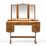 Hugh Birkett (1919-2002) Dressing table mirror and five drawers over shaped and carved supports