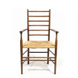 In the Manner of Ernest Gimson Armchair rush seat, ladder back, turned details 98cm high