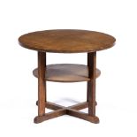 In the manner of Heals Oak coffee table round top made from four pieces of wood over a single shelf,