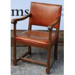 Heals Tilden oak armchair, circa 1910 turned supports and legs, and leather upholstered seat 90cm