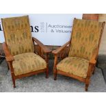 Arts & Crafts Pair of oak armchairs one a recliner, stylised cut-outs, upholstered Morris style