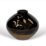 In the Manner of David Leach Stoneware vase Tenmoku glaze with foliate motif decoration 20cm high