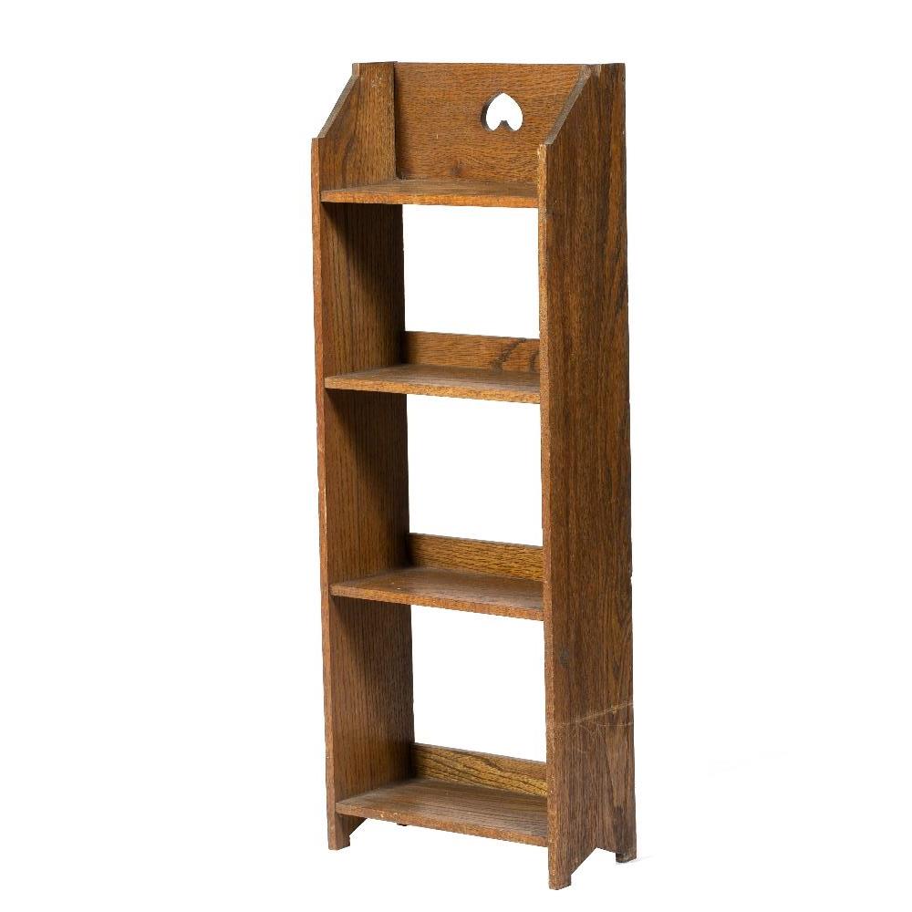 In the manner of Liberty & Co Small mahogany bookshelf heart cut out, four shelves 86cm high