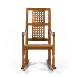 Mouseman Oak rocking chair lattice work back, leather seat, pegged joints and carved details