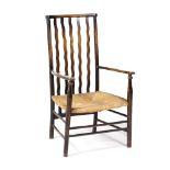 Liberty & Co Pair of stained wood armchairs rush seats, carved back supports, turned legs 85cm