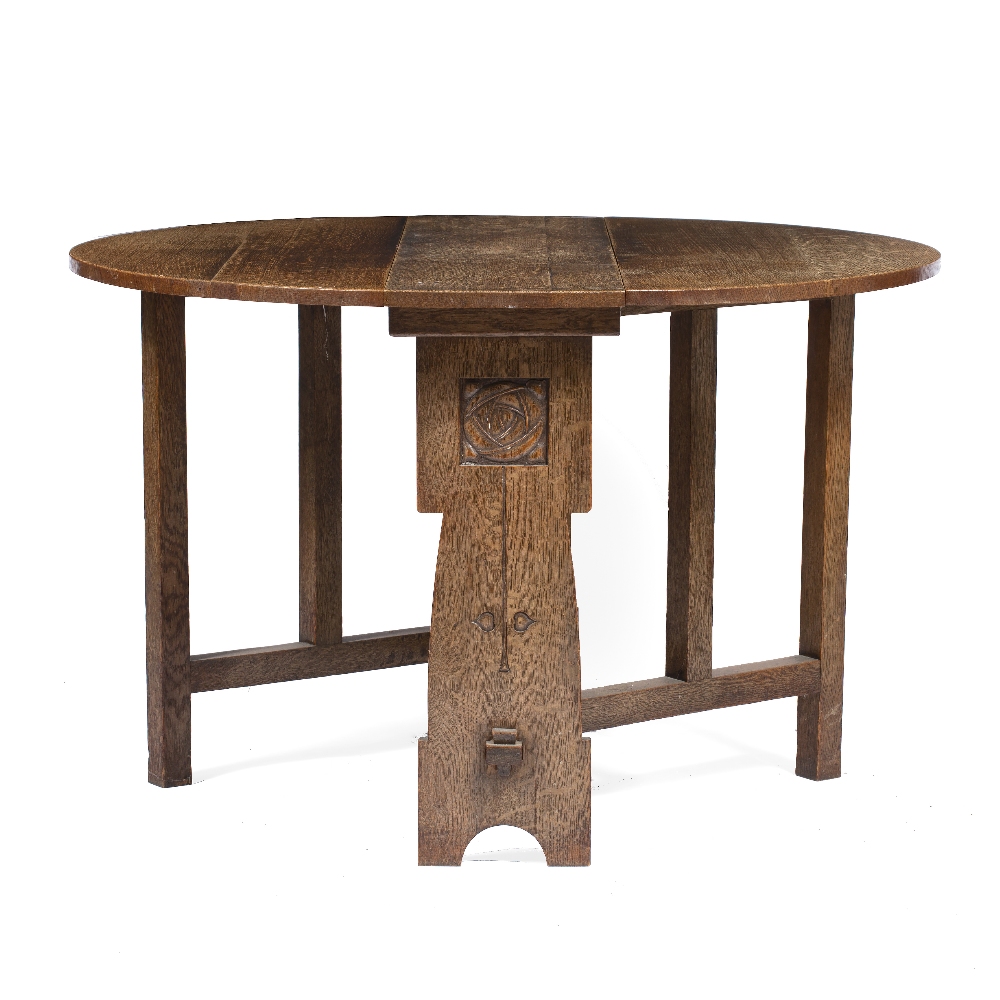 In the manner of Liberty & Co Oak drop leaf table carved to the ends with rose decoration, pegged