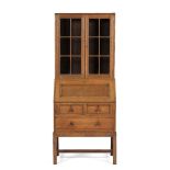 Heals Oak bureau bookcase, circa 1920 glass fronted bookcase over a single cupboard and three