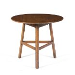 Heals Oak cricket table, circa 1910 plank top over three squared legs, 76cm diameter, 65cm high