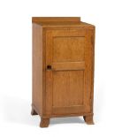 Heals Oak bedside cabinet, circa 1910 panelled door finished with an ebony handle, cedar shelves,