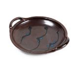 Ray Finch for Winchcombe Pottery (1914-2012) Stoneware dish blue nuka decoration on a red glaze