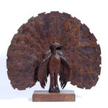 Wooden carving of a Peacock Malaysia, 20th Century carved as a central peacock with a plume of