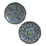 Two ceramic chargers Moroccan, 20th Century one decorated with foliate patterns, both decorated with