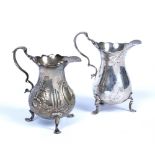 Two silver cream jugs both bearing marks for London, one marked Robert Pringle & Sons 1945, 10cm