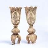 Pair of ivory vases India, 19th century of tulip form depicting seated rulers 18cm high (2)