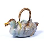 Continental majolica teapot in the form of a duck and a hard paste porcelain figure group of an