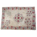 Suzani Uzbekistan with embroidered central panel and a surround 120cm x 95cm approx. Provenance: