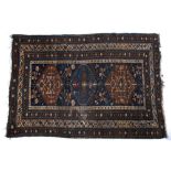 Caucasian Kuba rug blue ground, with three central medallions within a wide border 188cm x 127cm