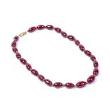 Ruby coloured amber necklace with metal clasp, (untested), 39cm across