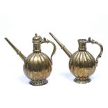 Pair of Mughal ewers India, 19th Century brass, of ribbed design, decorated with foliate patterns