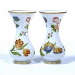 Pair of opaline glass vases, possibly Baccarat circa 1850-60, painted with individual garden