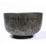 Large Safavid tinned-copper basin Iran, 17th Century the engraved decoration with repeating cusped