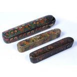 Three Qajar pen boxes (Qalamdan) Iran, 19th Century lacquered, all depicting floral motifs and slide