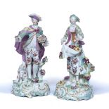 Pair of Derby porcelain figures after Dresden Shepherds circa 1770, both on rococo scrolling