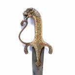 Shamsir sword South India, 18th Century with a curved watered blade, the hilt modelled as a lion