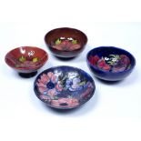 Four Moorcroft pottery bowls two in the Anenome pattern, two in the Flambe Columbine pattern with