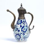 Porcelain ewer Turkey, circa 1900 painted in the Iznik style, with applied metal top and spout 30.