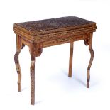 Fold over games table Morocco with inlaid body and interior, the inside revealing similar inlaid