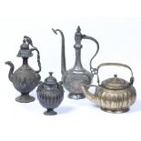 Collection of metalware Islamic to include two ewers, one decorated with a parrot to the lid, a