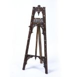 Carved hardwood easel North Africa, circa 1900 decorated with inlaid mother of pearl with pegs 134cm