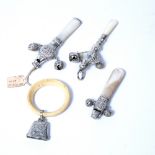 Three antique silver babies rattles, with mother of pearl handles and one additional rattle (4)