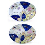 Pair of oval Continental dishes each with tobacco leaf decoration in the Chinese Qianlong style,