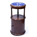 Mahogany washstand of circular form, with later blue and white ceramic bowl, stamped JAS