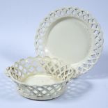 Pierced creamware basket and stand 19th Century with applied rope twist handles, measures 25cm