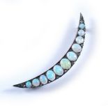 Crescent brooch set with graduated opals, clasp unmarked