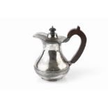 A SILVER HOT WATER POT, of baluster form, with hardwood handle and knop, by Atkin Brothers,