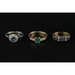 THREE GEM SET DRESS RINGS, comprising an emerald and diamond seven stone ring, 18ct gold mounted,