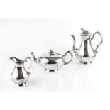 A MID VICTORIAN SILVER THREE PIECE TEA AND COFFEE SERVICE, comprising teapot, coffee pot and milk