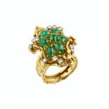 AN EMERALD AND DIAMOND DRESS RING BY GEORGE WEIL, designed as a tiered abstract flowerhead,