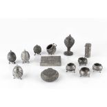 A COLLECTION OF INDIAN WHITE METAL CRUET ITEMS COMPRISING a vase shaped pepper, four further small