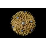 A SAPPHIRE AND DIAMOND SET PANEL BROOCH, modelled as a sea anemone, accented with a round