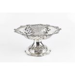 A LATE VICTORIAN SILVER PEDESTAL FRUIT STAND, with pierce decorated and foliate cast border, on