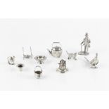 A COLLECTION OF SILVER AND WHITE METAL MINIATURES comprising a standing figure of a gentleman, 6.5cm