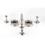 A GROUP OF SILVER ITEMS, comprising a baluster sugar castor, two bottle coasters, two pairs of